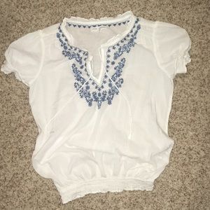 White blouse with floral collar